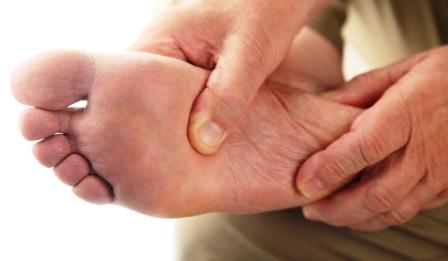 man with ball of foot pain having treatment in Cardiff