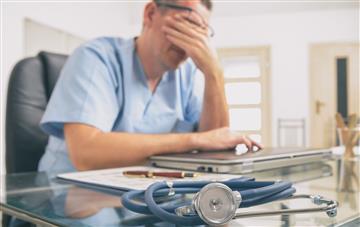 man in cardiff office with RSI repetitive strain work place injury