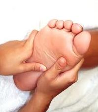 lady having reflexology in cardiff for pre-menstrual (PMS or PMT) relief at the Cardiff pre-menstrual reflexology centre