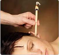 lady with hopi candles treatment for her Tinnitus and ear ringing with Hopi candles in cardiff
