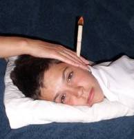 young boy having hopi ear candle treatment in cardiff for asthma and allergy to relieve his  ADHD