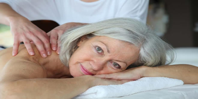 elderly woman having a stress massage treatment for stress and PTSD in Cardiff city centre